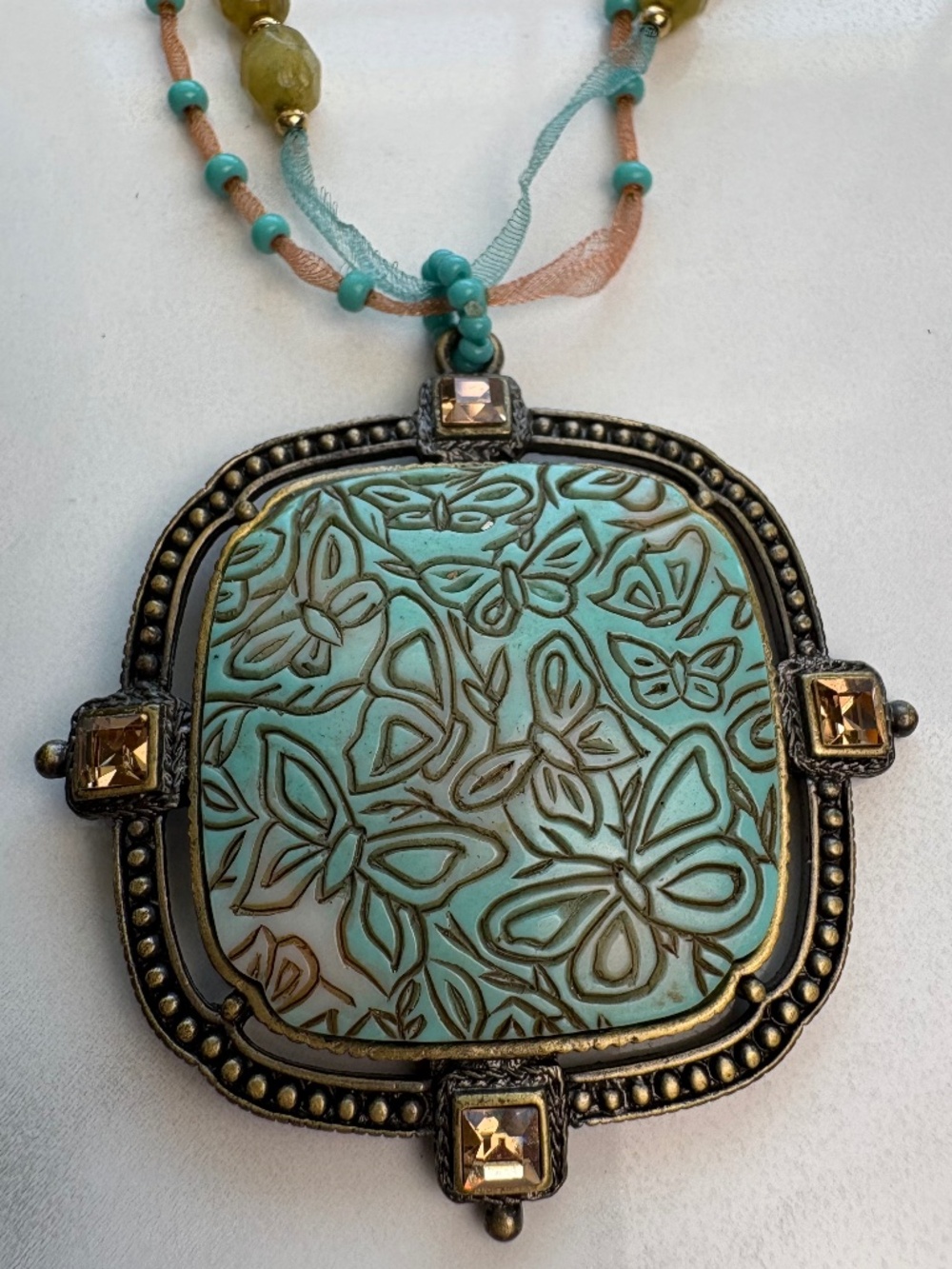 Monet Beautiful Bohemian Ceramic Butterfly Pendant Necklace in Brass Tone